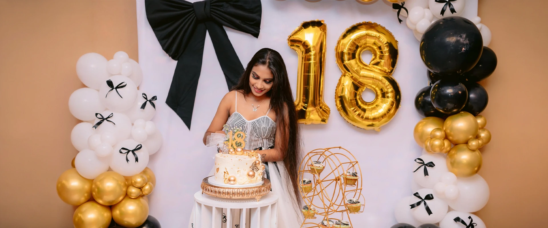 Birthday celebration with cake and elegant gold decorations